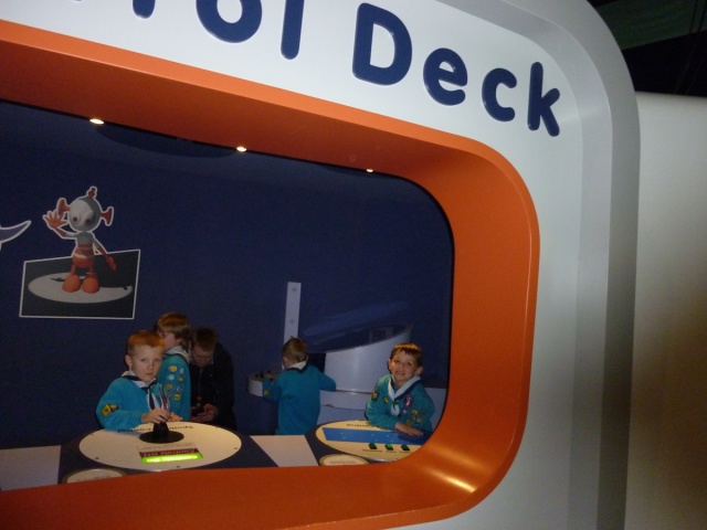 The beaver scouts are playing in a room named Control Deck.